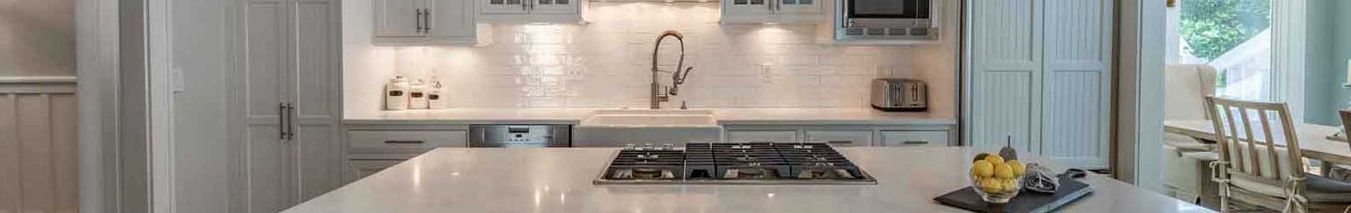 Modern coastal kitchen design with white cabinetry and natural light by Bella Coze Home