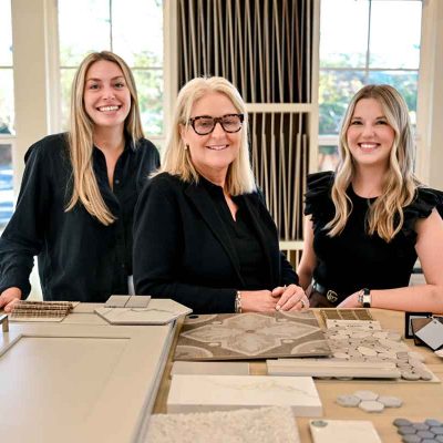 Full-Service-Design-Team Interior design team collaborating on a full home design project at a selection table